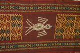 Hand woven ceremonial Sumba Hinggi Ikat Songket Textile 55"x 13.25" Geometric Designs. Handspun Cotton Tapestry, Dyed with Natural Pigments. Adorned with Symbolic Insect Motifs Created with Hand sewn tiny Nassa Shells (SR26) red rust background