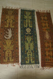 Hand woven ceremonial Sumba Songket Hinggi Ikat Textile (59" x 14"). Made from Hand spun Cotton, Tapestry Dyed with Natural Pigments. Adorned with Symbolic Lobster Motif Created with tiny Nassa Shells (SR9) Red rust background, colorful