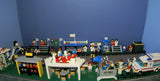 UNIQUE HUGE CUSTOM LEGO SET (1032 PCS): 41 MINIFIGURES (YEAR 1978 & ON), RACE TRACK, FINISH LINE, MULTIPLE BLEACHERS, 6 CARS, SNACK BAR, HELMET SHOP, GAS PUMP, AMBULANCE, REPORTERS, HOT DOG CART, MULTIPLE ACCESSORIES ETC... (KIT 10) 32" X 12"