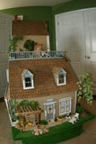 1970 HUGE CUSTOM BUILT & FULLY FURNISHED DOLL HOUSE (5 ft x 4ft x 32”) WITH 14 rooms & 3 gardens, Plants, Trees + Outhouse (1/12 Scale) Operating Lights