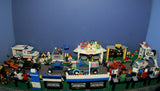 UNIQUE HUGE CUSTOM LEGO SET (1032 PCS): 41 MINIFIGURES (YEAR 1978 & ON), RACE TRACK, FINISH LINE, MULTIPLE BLEACHERS, 6 CARS, SNACK BAR, HELMET SHOP, GAS PUMP, AMBULANCE, REPORTERS, HOT DOG CART, MULTIPLE ACCESSORIES ETC... (KIT 10) 32" X 12"