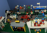 UNIQUE HUGE CUSTOM LEGO SET (1032 PCS): 41 MINIFIGURES (YEAR 1978 & ON), RACE TRACK, FINISH LINE, MULTIPLE BLEACHERS, 6 CARS, SNACK BAR, HELMET SHOP, GAS PUMP, AMBULANCE, REPORTERS, HOT DOG CART, MULTIPLE ACCESSORIES ETC... (KIT 10) 32" X 12"