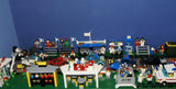 UNIQUE HUGE CUSTOM LEGO SET (1032 PCS): 41 MINIFIGURES (YEAR 1978 & ON), RACE TRACK, FINISH LINE, MULTIPLE BLEACHERS, 6 CARS, SNACK BAR, HELMET SHOP, GAS PUMP, AMBULANCE, REPORTERS, HOT DOG CART, MULTIPLE ACCESSORIES ETC... (KIT 10) 32" X 12"