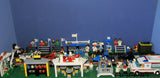 UNIQUE HUGE CUSTOM LEGO SET (1032 PCS): 41 MINIFIGURES (YEAR 1978 & ON), RACE TRACK, FINISH LINE, MULTIPLE BLEACHERS, 6 CARS, SNACK BAR, HELMET SHOP, GAS PUMP, AMBULANCE, REPORTERS, HOT DOG CART, MULTIPLE ACCESSORIES ETC... (KIT 10) 32" X 12"