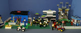 UNIQUE CUSTOM LEGO SET WITH 1905 PCS, 24 MINIFIGURES, 4 BUILDINGS: GRINGOTTS GOURMET CAFÉ WITH OUTDOOR TABLES & UMBRELLAS, CITY BANK, STORAGE BLD, PUBLIC BATHROOM, FIRE BRIGADE, TRUCKS, PLAYGROUND, GARDENS, MOTOCYCLES ETC (KIT 22)