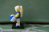 BRAND NEW, NOW RARE, RETIRED LEGO MINIFIGURE COLLECTIBLE: CHEERLEADER WITH 2 POMPOMS & BLACK BASE (Serie 1) YEAR 2009, 7 PIECES