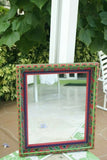 UNIQUE MOLA MIRROR WITH COLORFUL MOTIFS ON INTRICATE HAND PAINTED FRAME SIGNED BY FLORIDA ARTIST ITEM DA31 AND LARGE SIZE 28" X 23 ½”