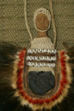 Rare Body Art : Dani Big Man Pectoral Trophy, Bride Price, Currency, Feud Payment Collectible: Ammonite, Cassowary, Seed beads, Bark Twine, Hand Carved Ancestor Face etc… late 1900’s. Museum Quality, Baliem Valley, Irian Jaya, New Guinea.
