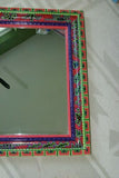 UNIQUE MOLA MIRROR WITH COLORFUL MOTIFS ON INTRICATE HAND PAINTED FRAME SIGNED BY FLORIDA ARTIST ITEM DA31 AND LARGE SIZE 28" X 23 ½”