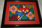 A Kuna Indian Folk Art Mola from San Blas Islands, Panama. Wall Decor, in Custom Frame & Mat. Hand stitched Textile Applique: Colorful Parrot & Hibiscus Flowers, plants 16" x 12" (DFM3)