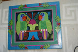 A Framed Kuna Indian Folk Art Mola from San Blas Islands, Panama in Hand Painted Frame With Wood Leaves, Glass & Double Mats. Hand stitched  Applique: Green Parrots On a Perch 20.5" X 17.5" (DFM20) WALL DECOR