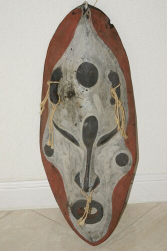 RARE UNIQUE OCEANIC ART LARGE HAND CARVED TRIBAL  POLYCHROME WAR CANOE BOAT PROW PROTECTIVE ANCESTOR EFFIGY SPIRIT MASK COLLECTED ON SEPIK RIVER PAPUA NEW GUINEA NATURAL CLAY & LIME PIGMENTS BARK TWINE 12A11 DESIGNER COLLECTOR 26.5