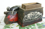 ANTIQUE HAND CARVED HAND PAINTED BETEL BOX FROM WEST JAVA, KOTAK, REPRESENTING AN ANCESTOR ON THE LID, A PROTECTIVE FIGURE PLACED THERE AS A GENERATOR OF GOOD FORTUNE FOR THE OWNER OF THE BOX: UNIQUE COLORFUL HANDMADE QUID CONTAINER FOR BETEL HABIT