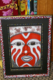 RARE UNIQUE AUTHENTIC COLORFUL FOLK ART PAINTING PANGA TRIBE WARRIOR FROM PAPUA NEW GUINEA ARTIST FRAMED IN SIGNED HAND PAINTED FRAME TO MATCH THE ART WITHIN 33” X 24 ½” DFP4 DESIGNER COLLECTOR WALL ART