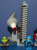 LEGO, 6 NOW RARE RETIRED ALIEN CONQUEST MINIFIGURES: ALIEN TROOPERS AC003, ALIEN DEFENSE UNIT SOLDIER AC016 + 2 UNIQUE CUSTOM BUILDS: ROCKET LAUNCH TOWER & ROCKET, ASTONAUT TOOL BENCH 194 PCS. (KIT ITEM SET 51)