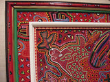 Kuna Indian Folk Art Blouse Mola Panel from San Blas Islands, Panama. Hand stitched Reverse Applique:  Fisherman Dog Catching Fish 17" x 10.5" (42A)
